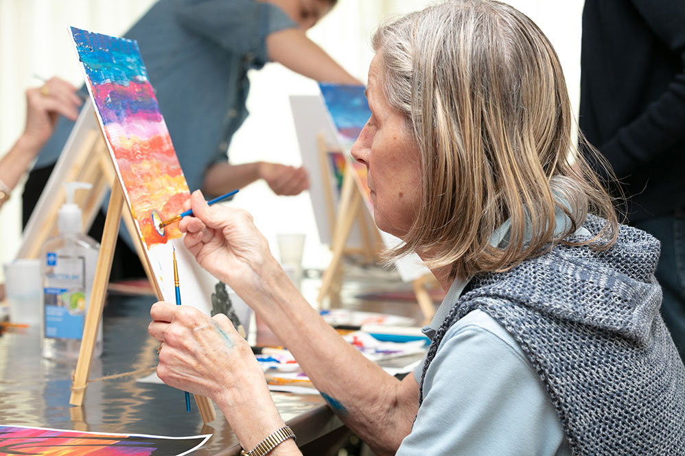 Senior woman painting
