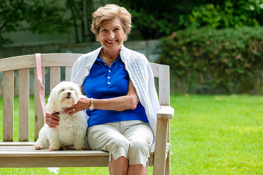 Senior woman posing with her dog