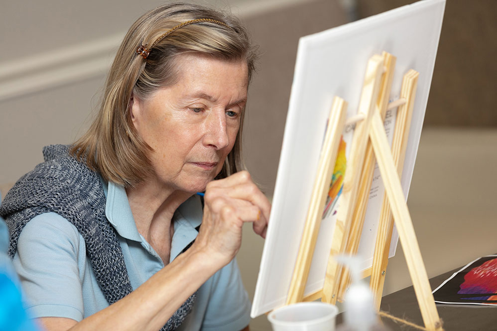 Senior woman painting